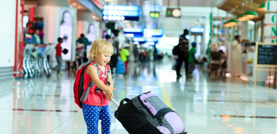 bigstock-little-girl-with-suitcase-trav-98428964-airport